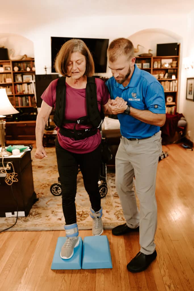 In-House Physical Therapist - Dr Charles helping patient walk